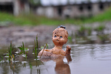little doll in the water