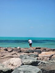 Capturing Memories: Man Photographing the Sea