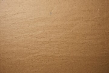 A close up texture of crumpled and creased brown paper surface background for design and wallpaper....