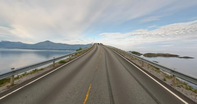 Driving a Car on a Road in Norway Atlantic Ocean Road or the Atlantic Road (Atlanterhavsveien) been awarded the title as (Norwegian Construction of the Century).