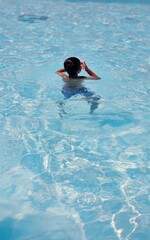 Young Swimmer: 6-Year-Old Enjoying Pool Time