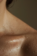 Beauty model female woman shoulder perfect glowing nourished hydrated wet shower skin care, close up detail.