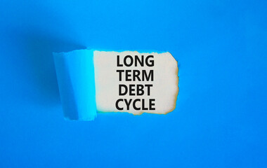 Long term debt cycle symbol. Concept words Long term debt cycle on beautiful white paper. Beautiful blue background. Business Long term debt cycle concept. Copy space.