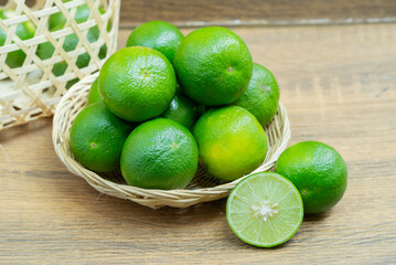 Round Thai lime The skin is green and rough. It is an important ingredient in Thai cooking.