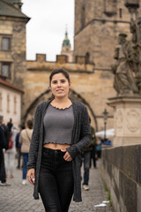 Fototapeta na wymiar Woman posing on Charles Bridge in Prague