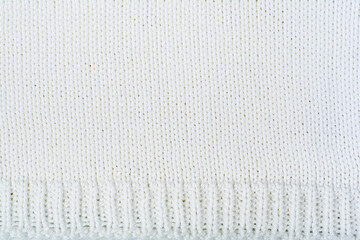 Sweater or scarf fabric texture large knitting. Knitted jersey background with a relief pattern....
