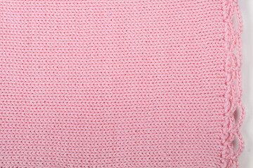 Sweater or scarf fabric texture large knitting. Knitted jersey background with a relief pattern....