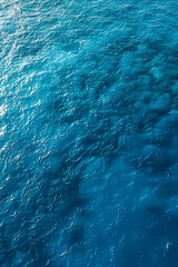 Obraz premium Sea surface. Aerial view of blue clean sea. Vertical summer background. Copy space.