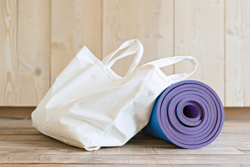 Yoga Mat in a White Tote Bag Symbolizing a Health and Wellness Lifestyle
