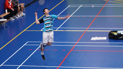 young man plays single badminton