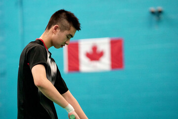 young man plays single badminton