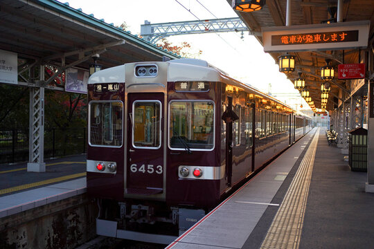 OSAKA, JAPAN - NOV 13, 2019: Hankyu railway train first trip arrival to Arashiyama in the early morning
