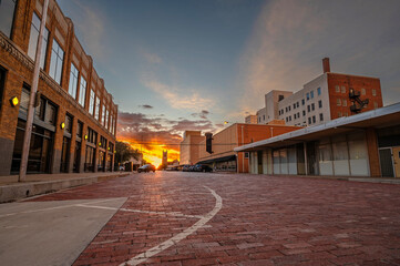 Sun setting on a old brick street in downtown, Lubbock, Texas, United States