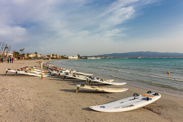 Fototapeta na wymiar Windsurf boards on the Poetto beach in Cagliari. Sardinia, Italy