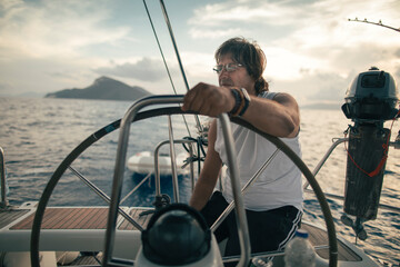 Mature man enjoy time on sailboat