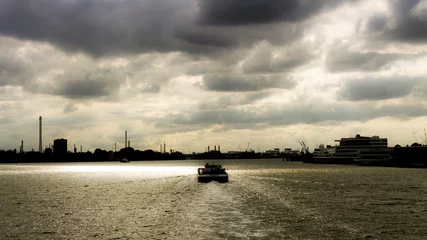Wandaufkleber Apocalyptic sky over the port of Rotterdam, Netherlands © JoseJ81