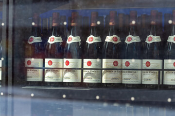 Fototapeta premium wine bottles in display window at LCBO, a liquor store, located at 15 Cooper Street in downtown Toronto, Canada
