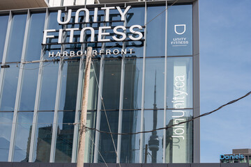 Fototapeta premium exterior building facade and sign of UNITY Fitness Harbourfront located at 120 Downes Street in downtown Toronto, Canada
