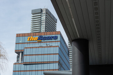 Fototapeta premium exterior building facade and sign of The Score, a media company, located at 125 Queens Quay East in Toronto, Canada