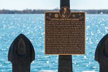 Fototapeta premium Captain John's Pier Anchor Sculpture and plaque located in Toronto, Canada
