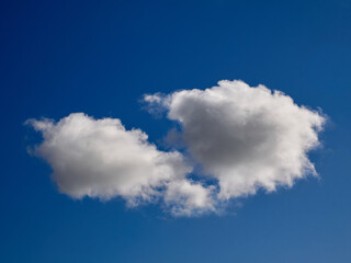 Naklejka na ściany i meble White fluffy clouds in the sky background. Cumulus clouds