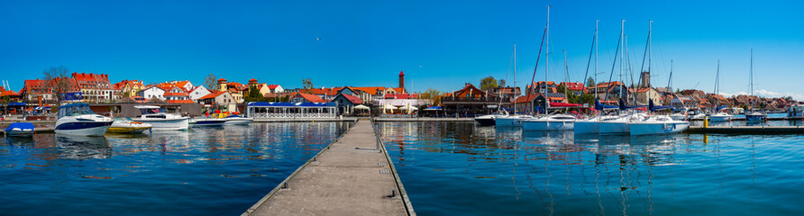 2023-04-22; panorama Mikolajskie Lake of town, marina for yachts and boats at the waterfront....