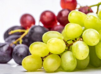 Green and red grapes isolated on white background closeup