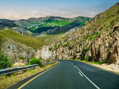 Winding R45 through a varied landscape of mountains, rocky valleys of Theewaters Nature Reserve, western Cape, South Africa