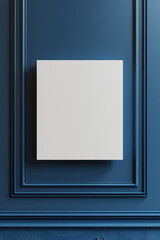 A white blank canvas hanging on a clean blue color wall