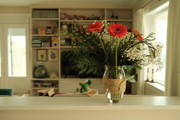 vase of flowers in the living room of a house