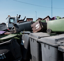 Heap of recycling bins at waste recycling and disposal works
