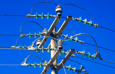Power pole cable box with blue sky in Mexico.