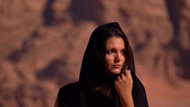 Traditional Young Woman Dancing In The Wadi Rum Desert, Jordan