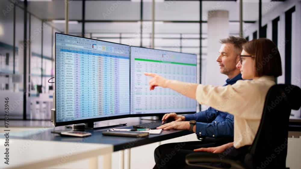 Poster analyst employee working on spreadsheet