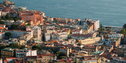 Naples, Italy. Top View Cityscape Skyline Of House In Residential Area And Part Of Gulf Of Naples In Sunny Day.