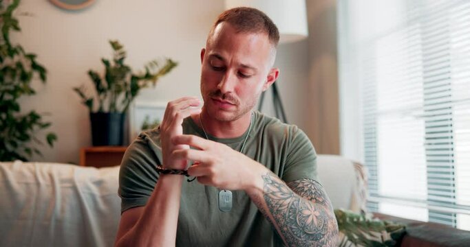 Healing, hands and man with eft tapping on sofa for anxiety, mental health and holistic wellness. Zen, calm and male person with spiritual energy for reiki treatment with peace in living room at home