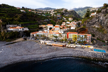 Ponta do Sol in Madeira Island, Portugal. Aerial drone view at cityscape of coastal town and beach - 778291300