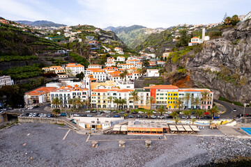 Ponta do Sol in Madeira Island, Portugal. Aerial drone view at cityscape of coastal town and beach - 778291513
