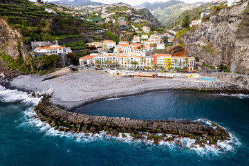 Ponta do Sol in Madeira Island, Portugal. Aerial drone view at cityscape of coastal town and beach - 778291547