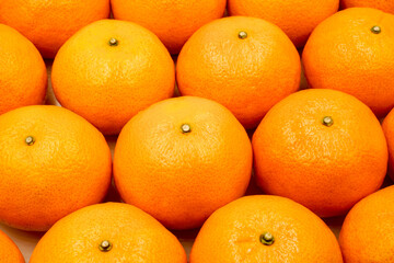 fresh oranges on the market as background