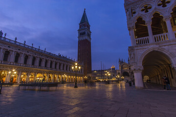 An empty illuminated San Marco square with the bell tower and Doge Palace at blue hour on a winter evening, Venice, Veneto, Italy - obrazy, fototapety, plakaty
