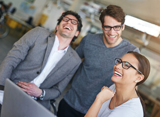 Team, laptop and happiness in office with laughing, cheerful and happy for company as colleagues. Businesspeople, group and employees in workplace, corporate and technology for meeting or teamwork