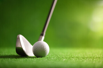 Close-up Golf ball with golf club iron graphite shaft at golf course. - obrazy, fototapety, plakaty