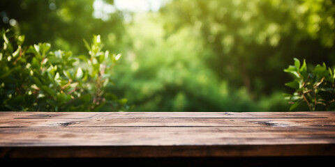 Banner with wooden table with green blurry nature background