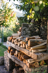 Logs of wood stacked for a fireplace at the backyard