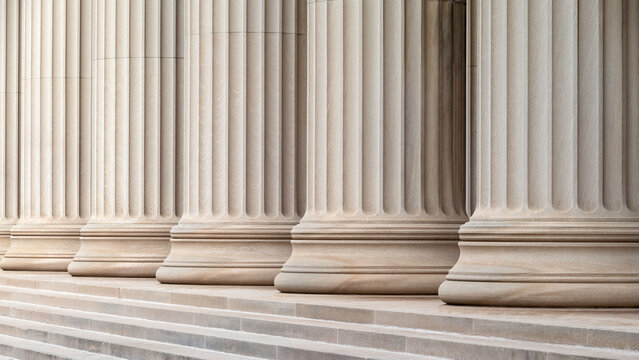 Architectural detail of some neoclassic columns in a row.