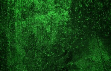 A textured green grunge background with dark patches and rough surface
