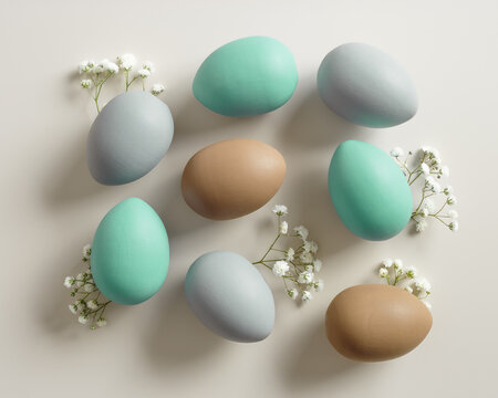 Easter Eggs pattern with White Gypsophila flowers on Light beige Background. Dyed colorful eggs in pastel colors, spring holiday photo, tender soft hues, flatly of celebration food and white blooms