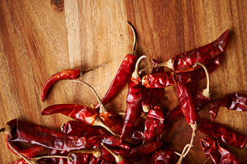Above, chilli and board for pepper, spices and flavor for dry ingredient for cooking, cuisine and...