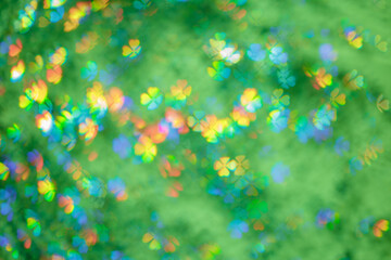 Defocused abstract botanical bokeh background green color, flare from lights, summer blurred bokeh...